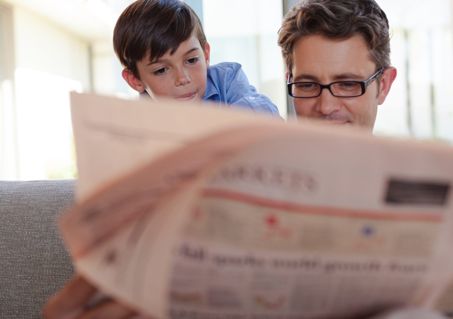 My father reads the newspaper